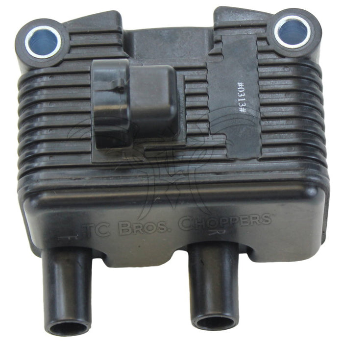 The Mid-USA .6Ω 12V Ignition Coil for 1999-2006 Harley-Davidson features cooling fins, two mounting holes, single-fire ignition support, two bottom cylindrical connectors, and a central wiring connector on top.