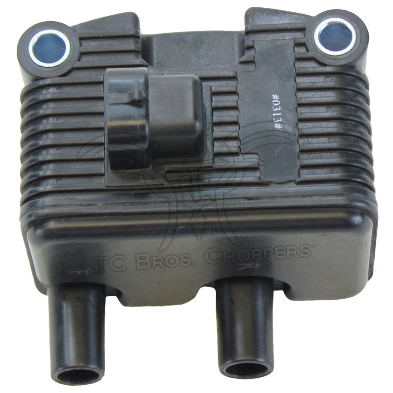 The Mid-USA .6Ω 12V Ignition Coil for 1999-2006 Harley-Davidson features cooling fins, two mounting holes, single-fire ignition support, two bottom cylindrical connectors, and a central wiring connector on top.