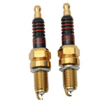 A pair of Drag Specialties Iridium Spark Plugs - 1999-2017 Twin Cam, 1986-2020 Sportster Models with an iridium electrode.