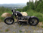 A Moto Iron® black Springer Kit for Yamaha XS650 stock length motorcycle with a pair of wheels on a white background.