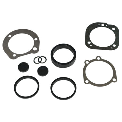A set of gaskets and seals for a car engine, including the James Gaskets Carburetor-to-Intake Manifold Seal Kit CV Carb.