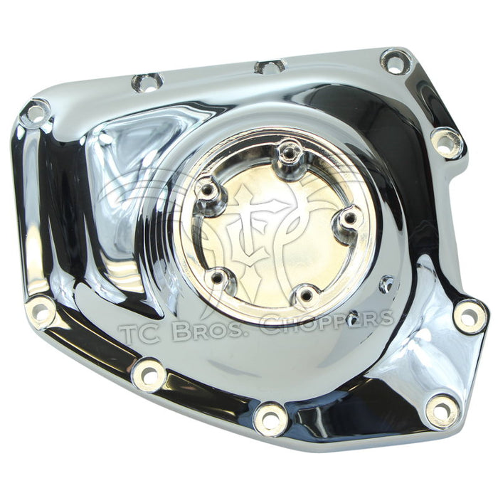 Mid-USA Cam Cover for 2001-2017 Harley-Davidson Twin Cam, chrome finish with multiple bolt holes, shown on a white background.