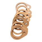 A stack of Moto Iron® Exhaust Gaskets for Harley-Davidson Big Twin 1966–1984, with circular and oval shapes and multiple holes, is arranged in an overlapping pattern on a white background.