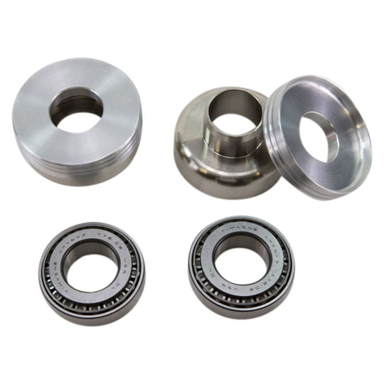 A set of Ironhead Sportster Steering Neck Cup Conversion Bearings 7/8 to 1 by TC Bros. on a white background.
