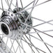 A close up of a chrome spoked Moto Iron® Chrome Front 40 Spoke Wheel 21 "x 2.15" (fits Harley FX,Sportster 1984-1999) Billet Hub on a white background.