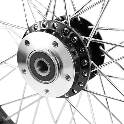 A close up of a Moto Iron® Black Front 40 Spoke Wheel 21 "x 2.15" (fits Harley FXD 2000-03, Sportster 2000-07) Billet Hub of a Harley FXD motorcycle.