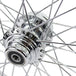 A close up image of a Moto Iron® Chrome Front 40 Spoke Wheel 21"x2.15" (fits Harley Softail 2000-2006, Dyna FXDWG 2000-2005) on a Harley Softail.