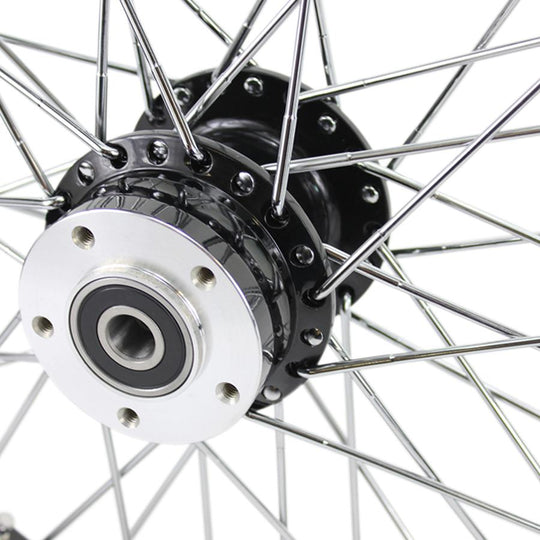 A close up of a Moto Iron® Black Front 40 Spoke Wheel 21"x2.15" (fits Harley Softail 2000-2006, Dyna FXDWG 2000-2005).