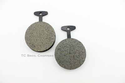 A pair of black and grey Yamaha XS650 EBC Front Brake Pads (Fits 72-76 XS XS2 TX) on a white surface.