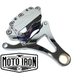 A Moto Iron® Left Side Springer Brake Caliper Kit in chrome, including bolts, washers, spacers, and a linkage rod, is displayed on a white background.