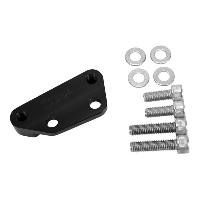 A black metal bracket, compatible with the TC Bros. Black Axial Brembo Front LH Bracket for 2008-2017 Harley 12.6in Rotors, comes with four washers and four screws arranged next to it.