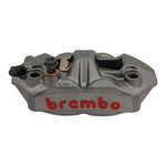 A Brembo M4 Radial Brake Caliper featuring a metallic finish, red Brembo branding, and visible mounting holes, displayed against a plain white background.