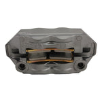 A Brembo M4 Radial Brake Caliper featuring a metallic finish, red Brembo branding, and visible mounting holes, displayed against a plain white background.