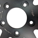 Two TC Bros. 11.8" front floating brake rotors for 2006-2025 Harley-Davidson, one with a wavy edge and one with a round edge, both featuring circular cutouts and bolt holes, are displayed on a white background.
