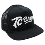 A TC Bros. Script Trucker Hat - Black/White with adjustable snapback closure, featuring TC Bros white lettering on it.