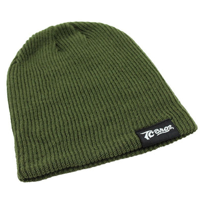 A TC Bros. Slouch Beanie - Surplus, made of Soft Acrylic, with a black logo on it.