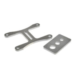 The Pangor Cycles DIY U-Weld Transmission Work Stand/Jig for Harley-Davidson Four-Speed features two metal parts—a Y-shaped piece with four holes and a rectangular plate with three holes—for secure transmission setup.