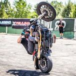 A man showcasing stopping power on a sportbike with TC Bros. 12.6in Black Front Radial Brake Bracket 2000-17 Harley conversions.
