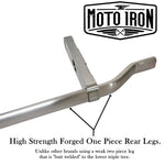 Two Moto Iron® Springer Front Ends for Harley-Davidson frames with 1" necks—one chrome, one black—are displayed side by side with a metal rod and two small parts. Ideal for custom Harley-Davidson springer setups.