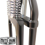Two Moto Iron® Springer Front Ends for Harley-Davidson frames with 1" necks—one chrome, one black—are displayed side by side with a metal rod and two small parts. Ideal for custom Harley-Davidson springer setups.