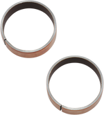 A pair of copper-colored circular metal rings with a small gap, identified as 39mm Fork Tube Bushings .588" wide OEM#45461-87 (99-05 Dyna 88-15 Sportster) from Moto Iron®, are displayed on a plain background.