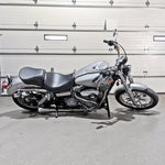 TC Bros. Rear Crash Bar for 2006-2017 Harley-Davidson Dyna, including bolts, washers, spacers, and a mounting bracket, is displayed on a white background.