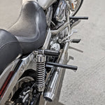 The TC Bros. Front Crash Bar for 1991-2017 Harley-Davidson Dyna is a black metal engine guard bracket with side mounts, bolts, washers, and extra metal pieces—perfect as a front crash bar for your Dyna motorcycle.