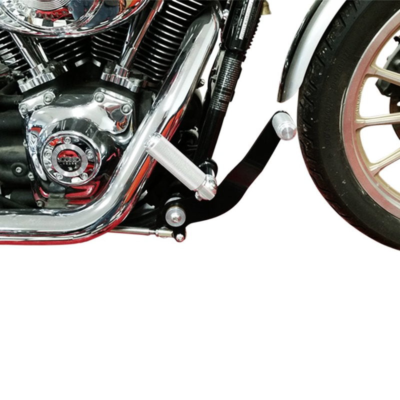 A close up of a TC Bros. Harley Dyna motorcycle with a TC Bros. bolt on forward controls kit and chrome engine, made in the USA.