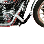 A close up of a TC Bros. Harley Dyna motorcycle with a TC Bros. bolt on forward controls kit and chrome engine, made in the USA.
