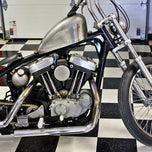 A TC Bros. vintage style black and white checkered floor in a garage.