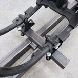 A motorcycle with a DIY Motorcycle Frame Jig Kit By Chop Source (Great for Chopper and Bobber Frame Building) attached to it.