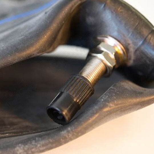 A Sedona Front Inner Tube 3.25/3.5-19 with a threaded metal valve stem attached to it.