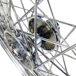A close up of a Mid-USA chrome rear 40 spoke wheel 16"x3" on a Harley Ironhead Sportster XL 1955-1978.