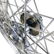 A close up of a Mid-USA chrome rear 40 spoke wheel 16"x3" on a Harley Ironhead Sportster XL 1955-1978.