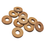 A stack of TC Bros. Leather Cushion Washers—round, flat, brown leather washers with a center hole for motorcycle vibration dampening—by TC Bros., displayed on a white background.