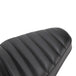 A close up of a TC Bros. Hardtail Rigid Mount Solo Seat Black Pleated motorcycle seat with horizontal pleated stitching style.