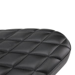 A close up of a TC Bros. Hardtail Rigid Mount Solo Seat Black Diamond chopper solo seat with diamond stitching style.