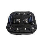A TC Bros. black leather pad with two metal clamp buttons on it.