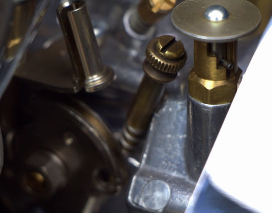 A close up of a Pangor Cycles All Thumbs Idle Speed Screw For S&S Super E / G Carburetor - Brass made in USA.