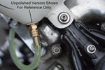 A motorcycle with a 3/8" NPT Male Brass Fuel Petcock by Prism Supply Co attached to the gas tank.