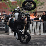 The TC Bros. 11.5" Profile Front Floating Brake Rotor for 2000-2014 Harley-Davidson features a stainless steel friction surface, black center hub, and multiple mounting holes, demonstrating TC Bros.' precision engineering and durable construction.