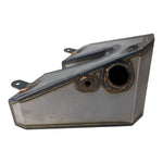 The TC Bros. Horseshoe Oil Tank Kit for 1982-2003 Sportster Hardtail features welded seams, two mounting tabs, and two differently sized circular openings on one side.
