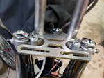 Flat, metallic Pangor Cycles Kneiss Rack Luggage Rack for 1960-Present Harley-Davidson hydraulic front ends, with elongated top slots and circular lower holes—ideal for custom builds. Shown on a white background.