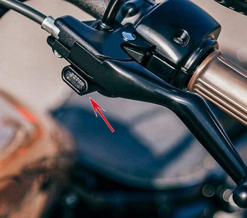 A close up of the Drag Specialties LED Handlebar Marker Lights 2004-21 Sportster - Chrome on a motorcycle.