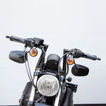 Two TC Bros. 1" Slant Z Handlebars—one chrome, one black—are shown parallel on a white background. Ideal for custom Harley or chopper upgrades, these quality bars are crafted by TC Bros.