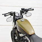 Two TC Bros. 1" Slant Z Handlebars—one chrome, one black—are shown parallel on a white background. Ideal for custom Harley or chopper upgrades, these quality bars are crafted by TC Bros.