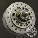 A stainless steel sprocket on a white background, featuring the Hughs HandBuilt Yamaha XS650 Speedometer Eliminator (fits 1975-1983) motorcycle.