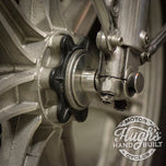 A stainless steel sprocket on a white background, featuring the Hughs HandBuilt Yamaha XS650 Speedometer Eliminator (fits 1975-1983) motorcycle.