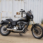The Saddlemen Step-Up Seat for 2006-2017 Harley-Davidson Dyna features a diamond-stitched pattern, contoured design, and built-in lumbar support. Shown against a white background. Brand: Saddlemen.