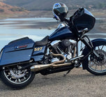 A motorcycle exhaust pipe with an American flag and a SP Concepts Lane Splitter Exhaust Twin Cam Touring 95-16 (stainless) on it.